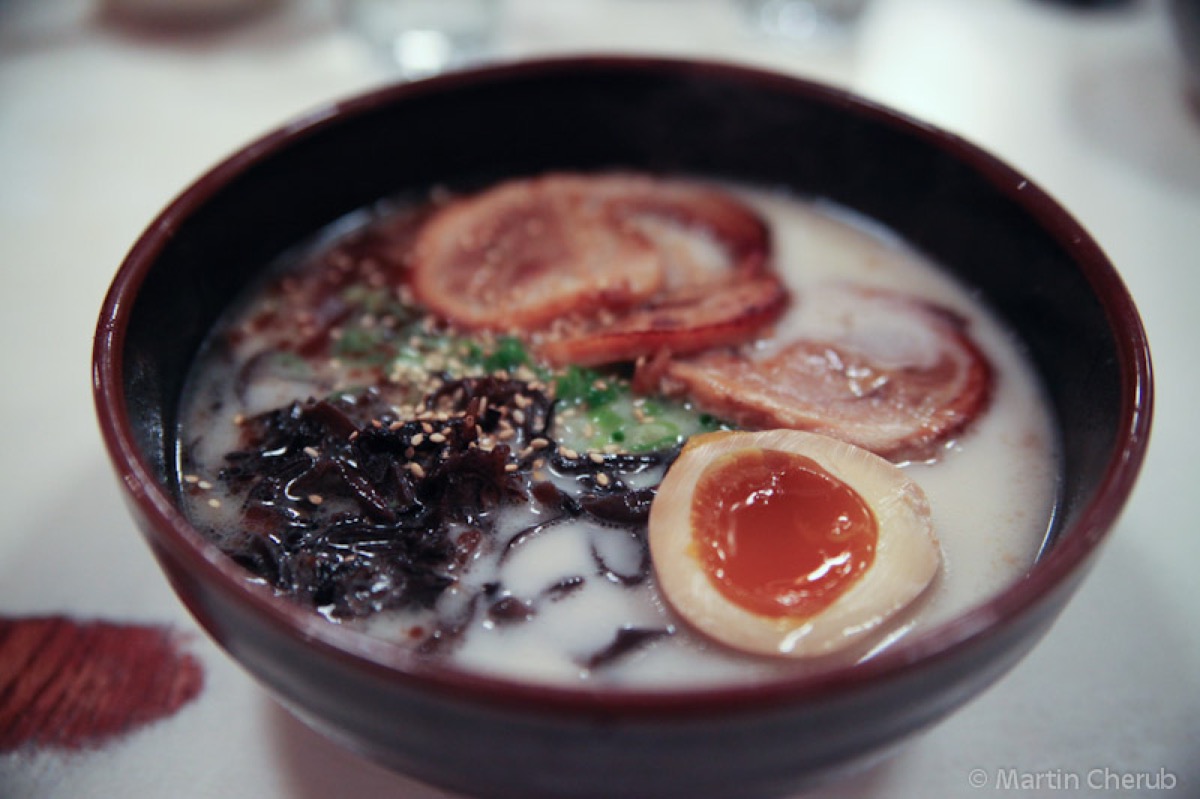 A steaming bowl of tonkotsu ramen with thin-cut pork at Tatsu-Ya in Austin