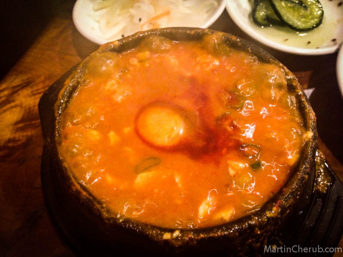 Soondubu tofu soup, still bubbling with an egg on top