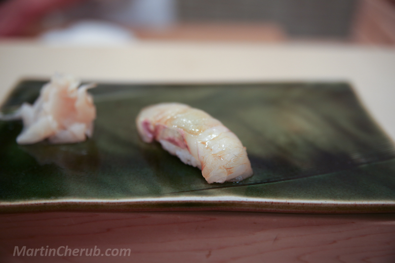 Hirame nigiri — delicate white fish with visible grain