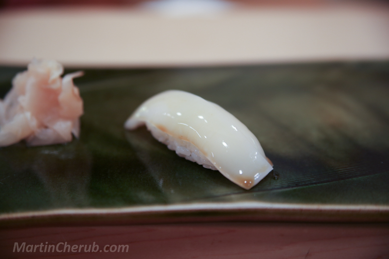 Sumi ika nigiri — glossy white cuttlefish