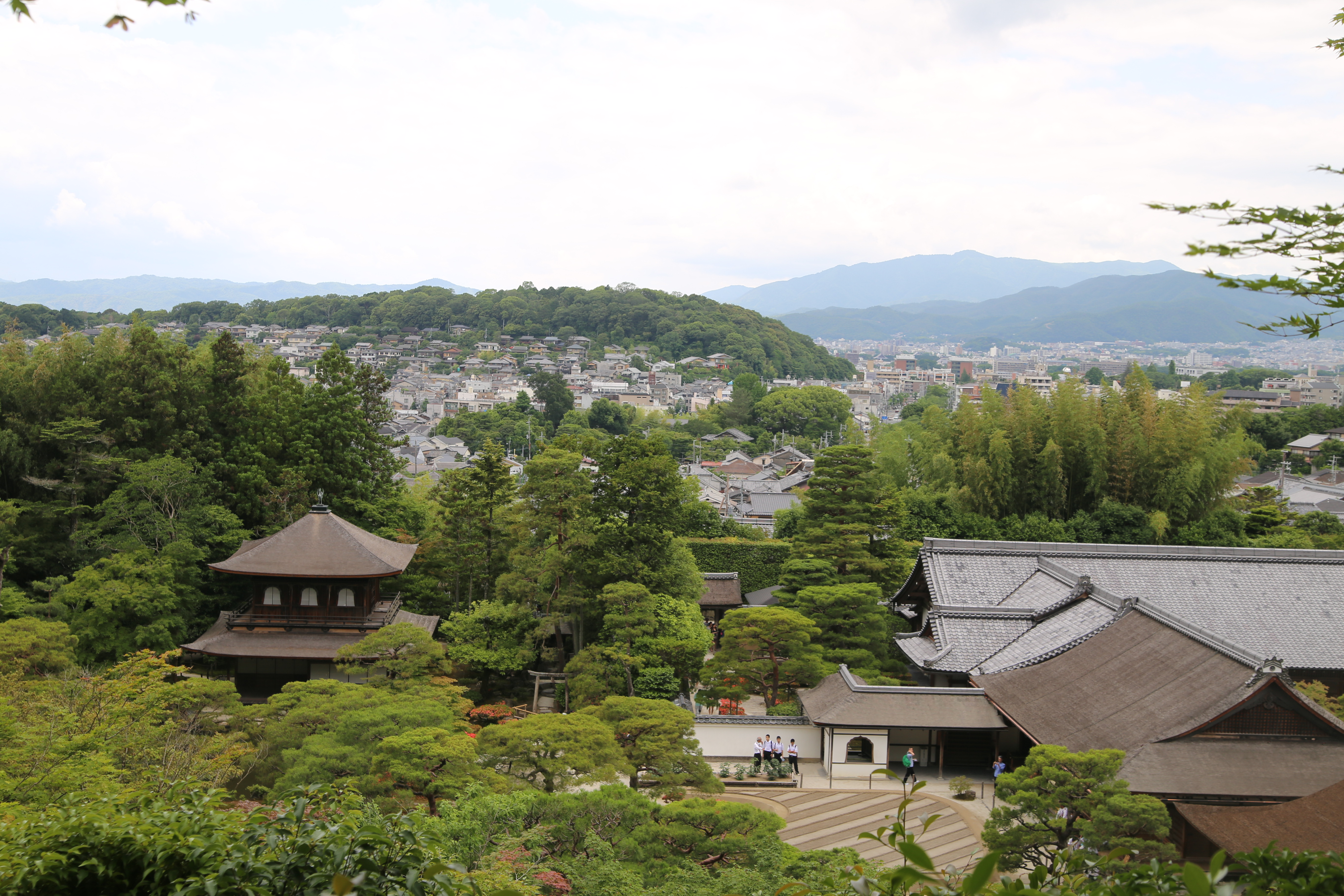 View of Kyoto from the temple grounds — rooftops and mountains in the distance