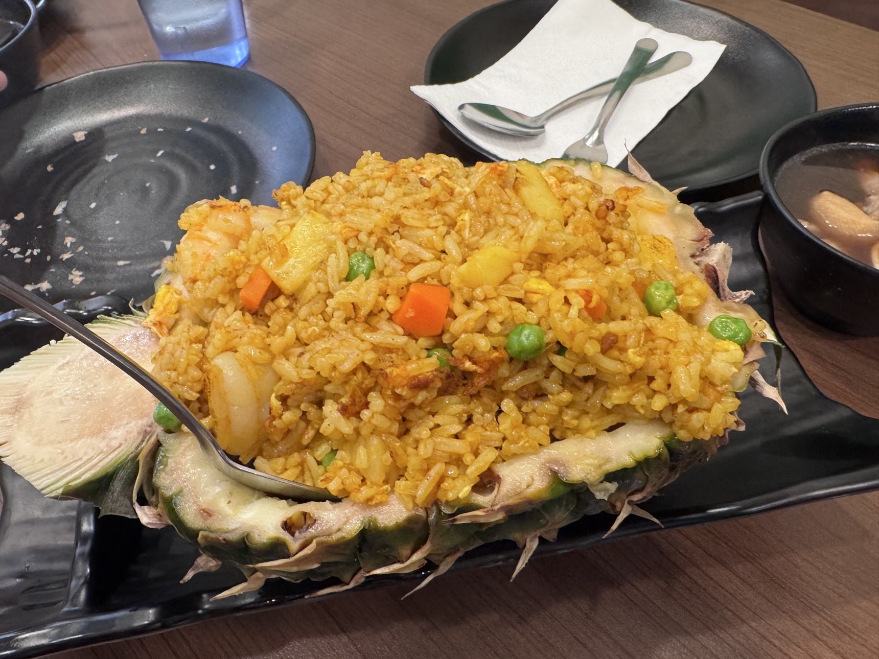 Pineapple fried rice served in a pineapple shell