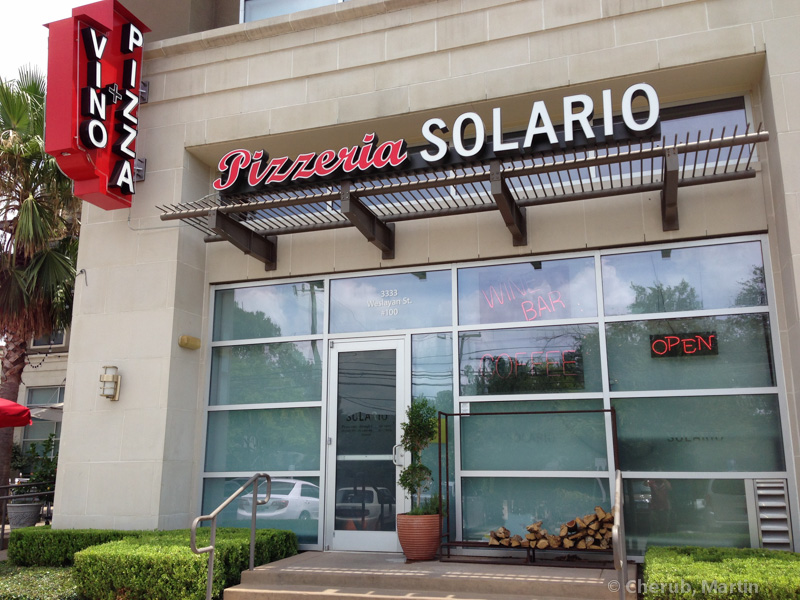 Pizzeria Solario storefront with the Pizza + Vino sign
