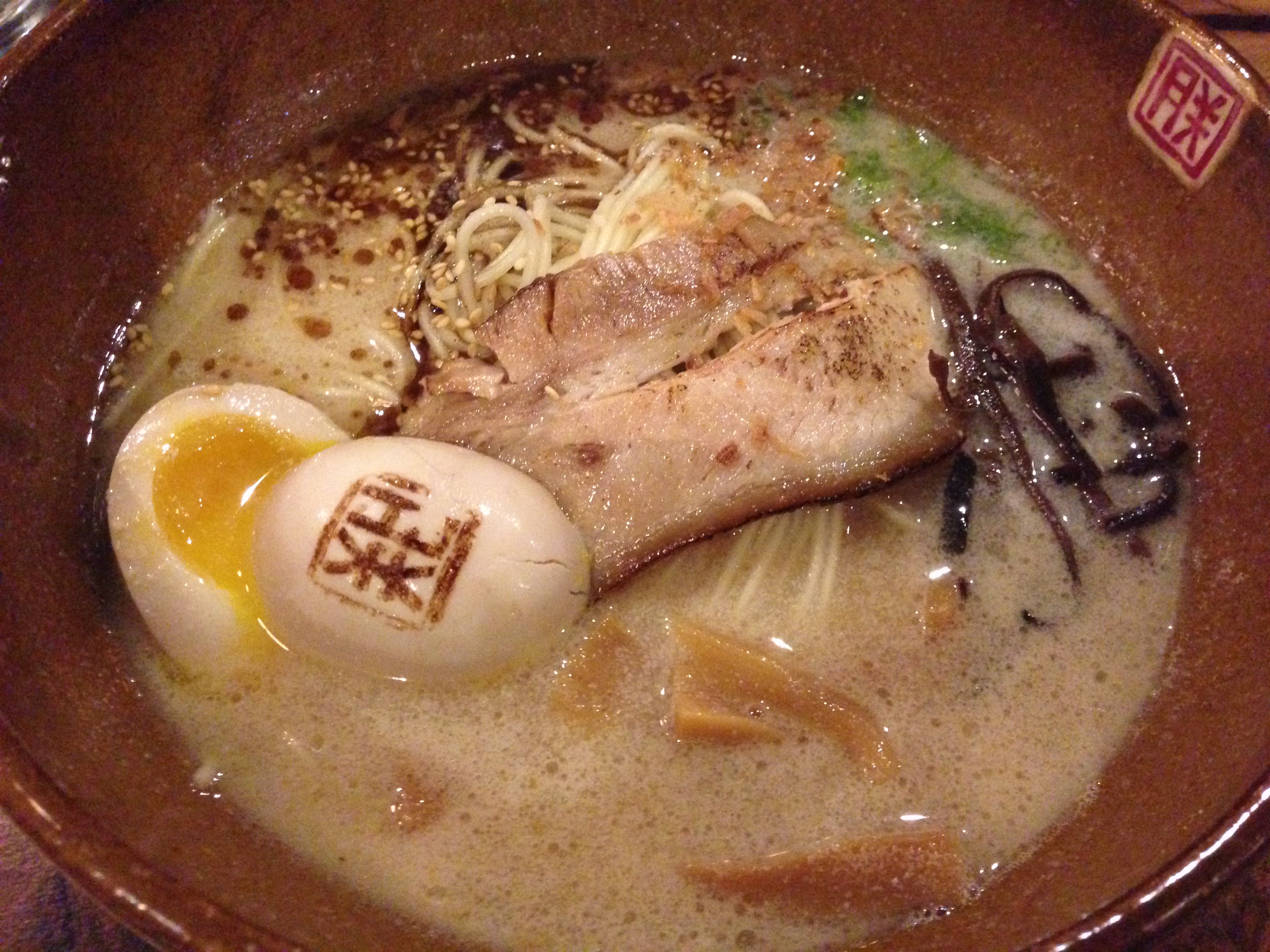 Tonkotsu ramen with branded egg, pork slices, and bamboo shoots at Ramen Jin, Houston