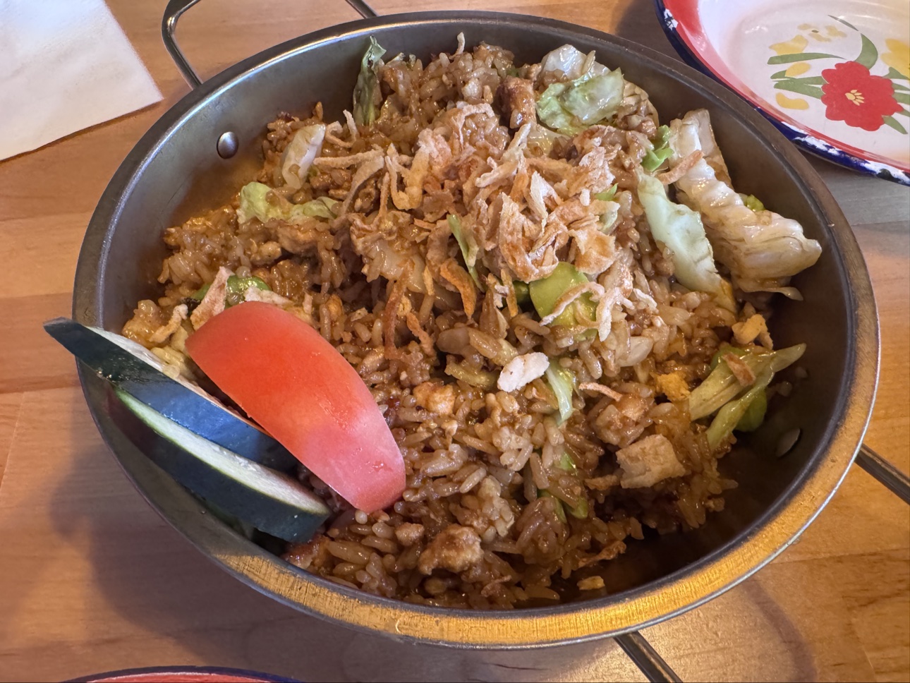 Javanese fried rice with chicken served in a metal pan