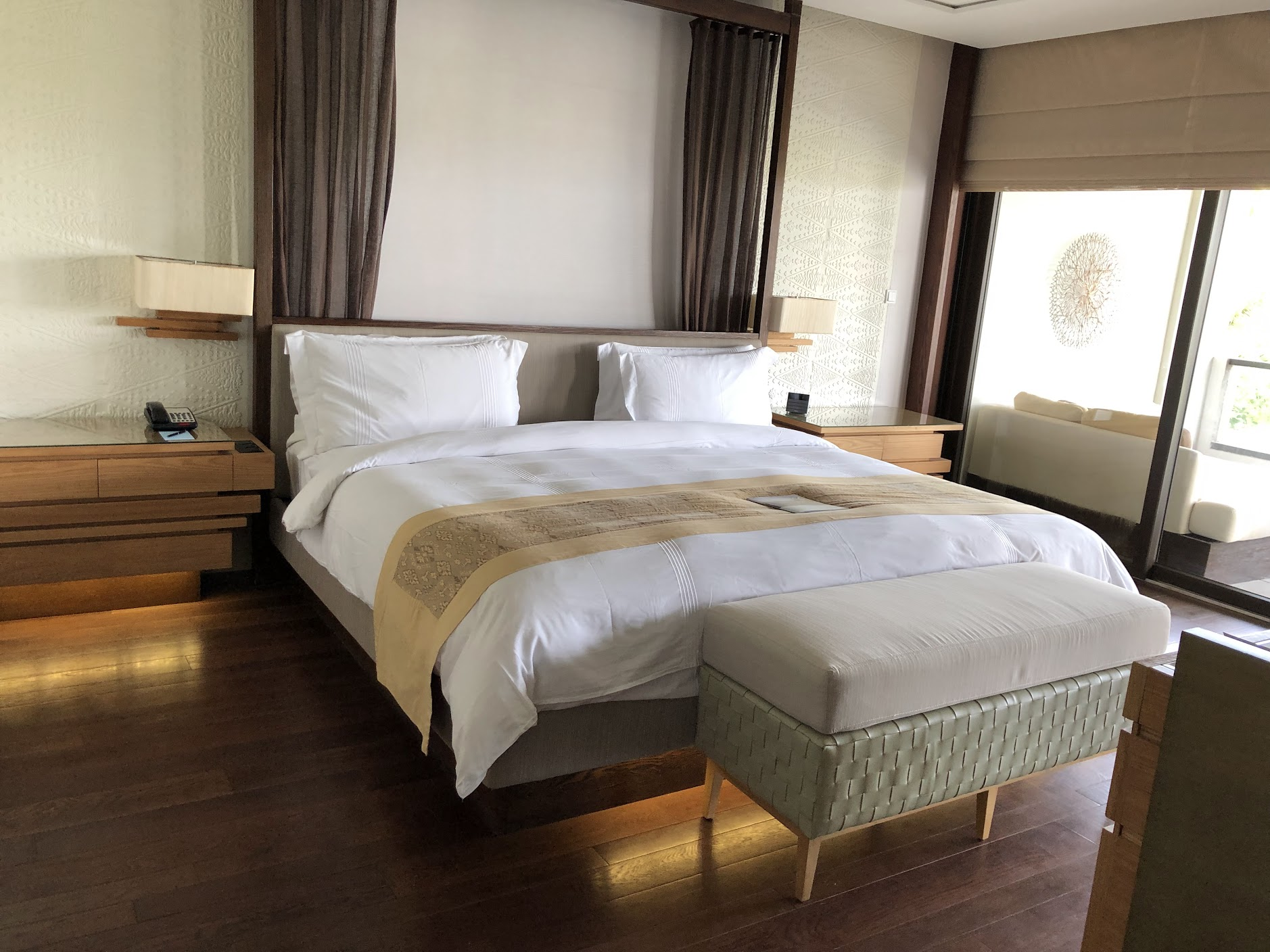 Suite bedroom with king bed and garden views