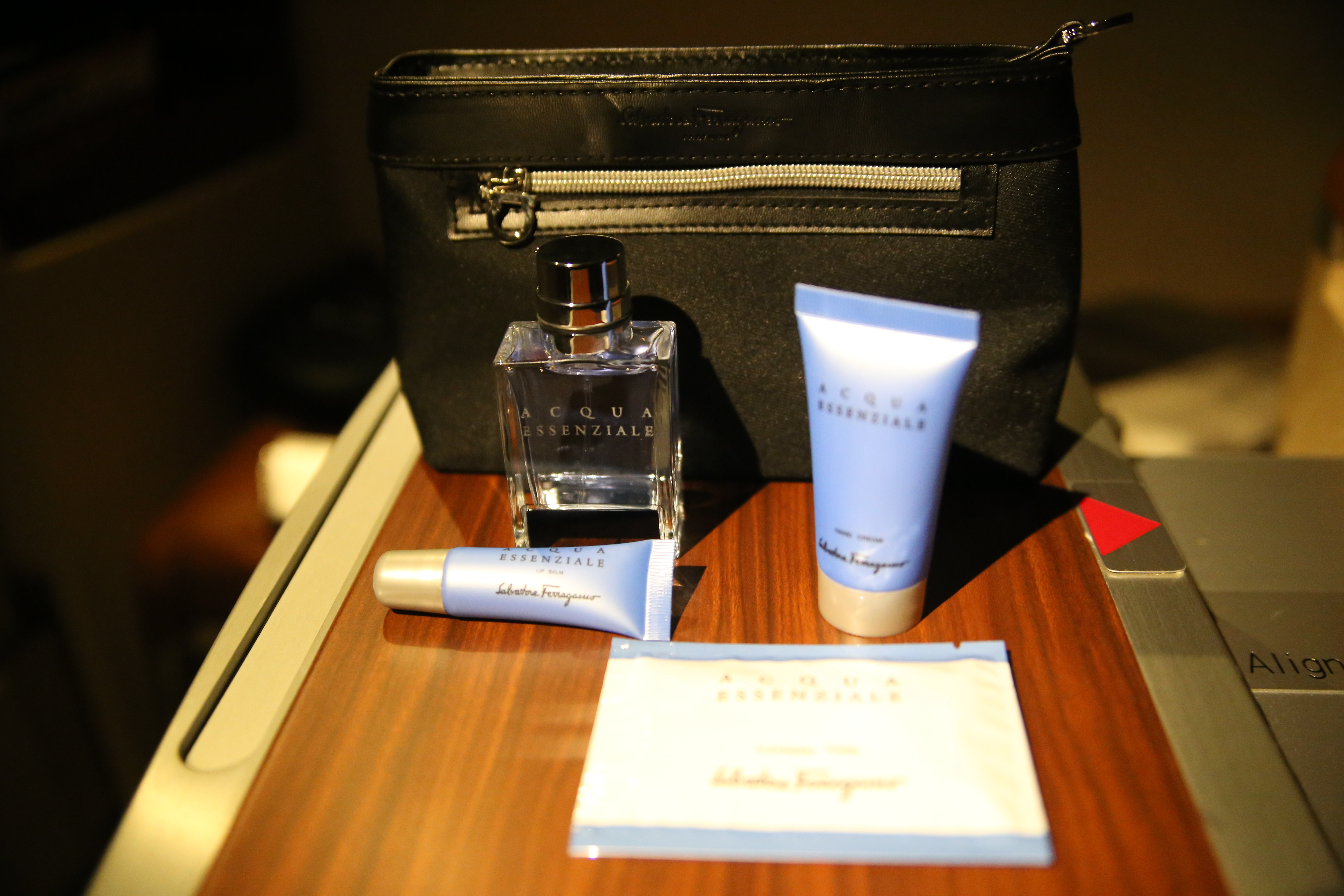 Ferragamo amenity kit — lotion, lip balm, cologne