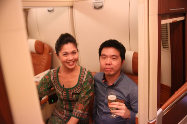 With one of the Suites Class stewardesses