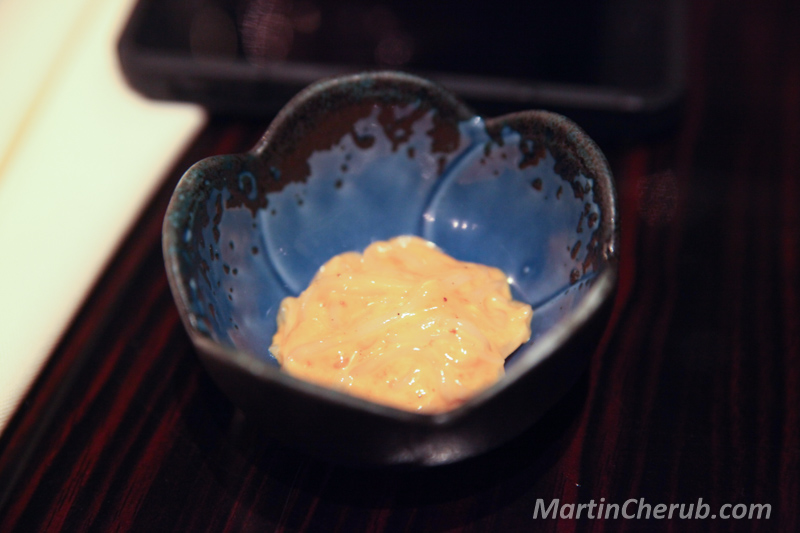 Condiment served in a flower-shaped ceramic dish