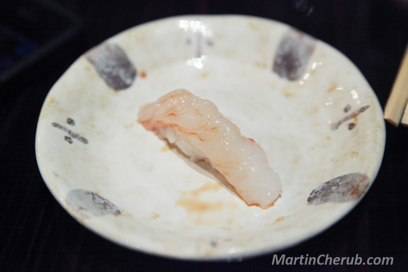 Nigiri on a cream plate with leaf motif