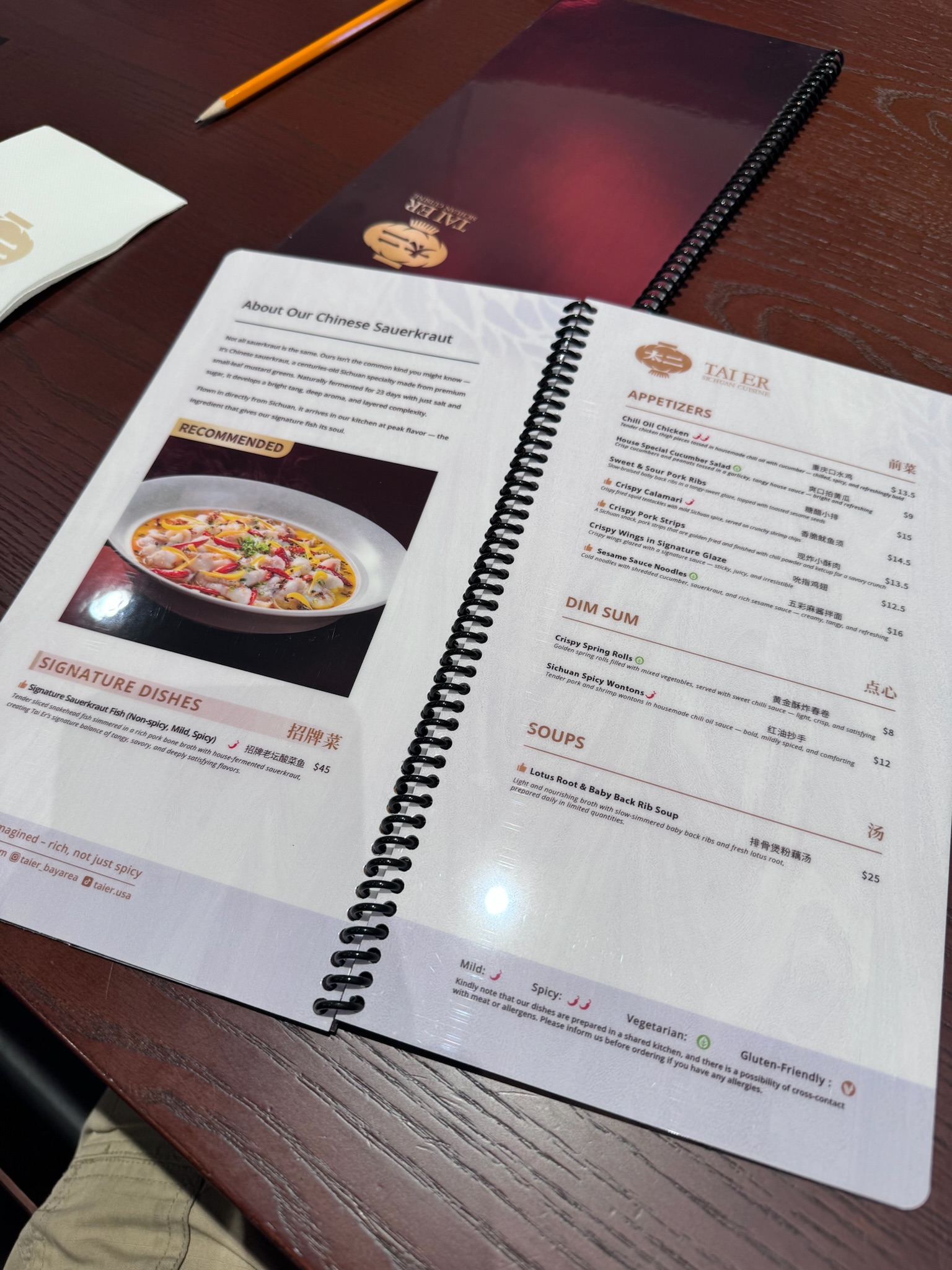 A menu page with "About Our Chinese Sauerkraut" and the Appetizers section — Chili Oil Chicken, Sweet & Sour Pork Ribs, Crispy Calamari, Crispy Pork Strips, Sesame Sauce Noodles, and Dim Sum items including Sichuan Spicy Wontons